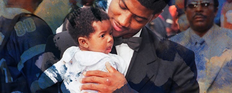 A father holds a baby.