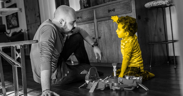 A child, highlighted in yellow, talks to their father about war.