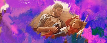 A dad and his son relax on the couch.