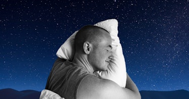 A man sleeping on a pillow at night.
