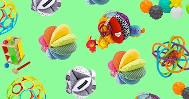 Colorful baby ball toys against a green background