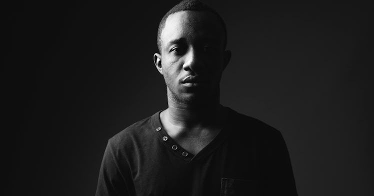 A black dad with a serious facial expression in a black and white photo