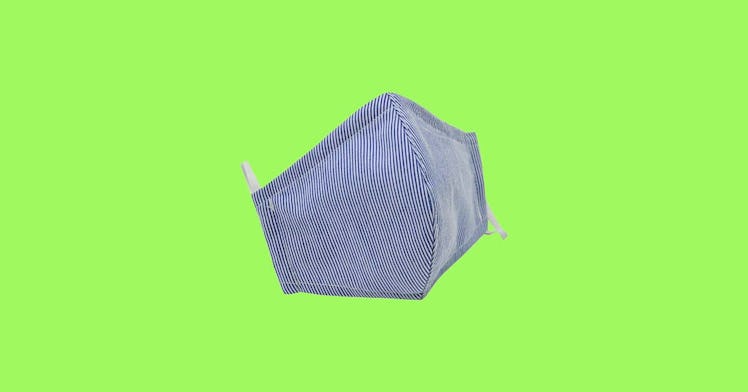 blue kids' face mask isolated on lime green background