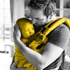 A father holding a baby in his Baby Carrier