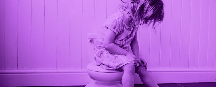 A toddler sitting on a potty