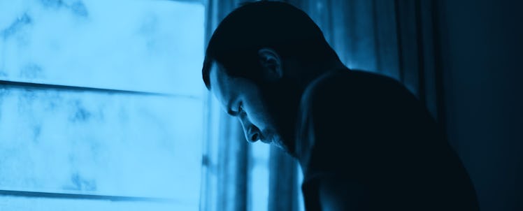 A depressed father looking out the window