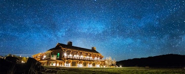 Brooks Lake Lodge & Spa from Dubois, Wyominat night with decorative exterior lights turned on