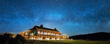 Brooks Lake Lodge & Spa from Dubois, Wyominat night with decorative exterior lights turned on