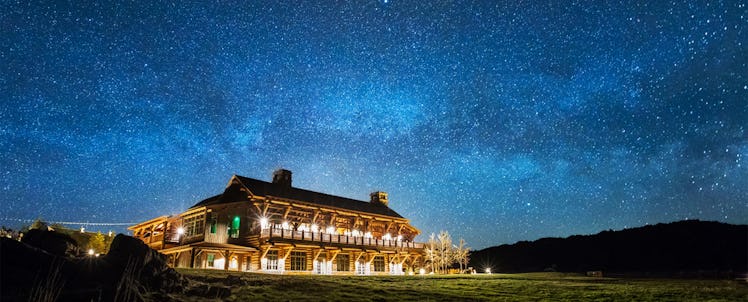 Brooks Lake Lodge & Spa from Dubois, Wyominat night with decorative exterior lights turned on