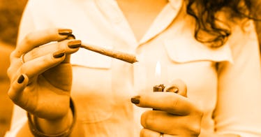 close up on woman lighting up a joint in attemp to start smoking weed while pregnant