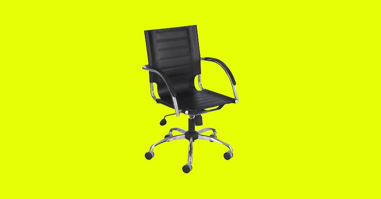 Black and chrome leather desk chair on a yellow background