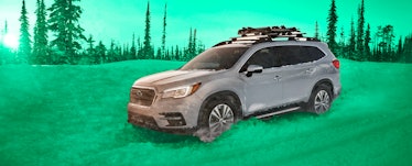 Silver 2021 Subaru ascent parked in the middle of the woods