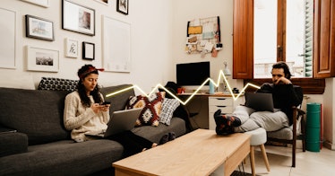 husband and wife sit in same room, not talking, with an animated zig zag line between them