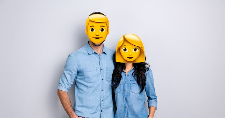 Boyfriend and girlfriend in blue shirts and their faces covered with gender emojis