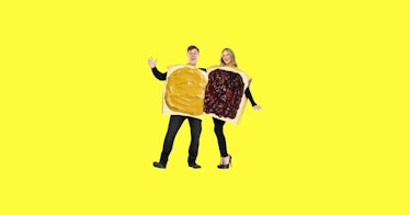 Peanut butter and jelly pregnant couples Halloween costumes against a yellow backdrop.