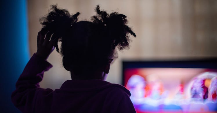 Young kid watches television