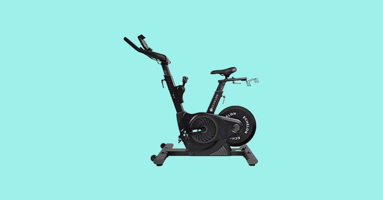 The Echelon EX3 Smart Connect Fitness Bike for high-tech at-home workouts, on a turquoise background...