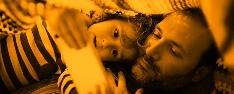A father playing with his daughter during COVID