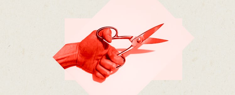 A hand with a pair of scissors representing a vasectomy