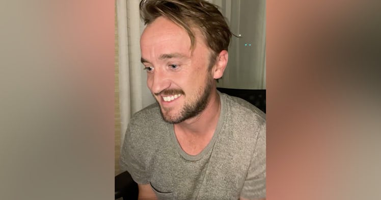 Tom Felton smiling on a video call 