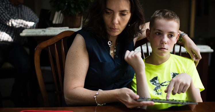 A mom sitting with her child with disability