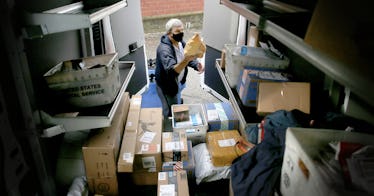 A USPS truck full of packages