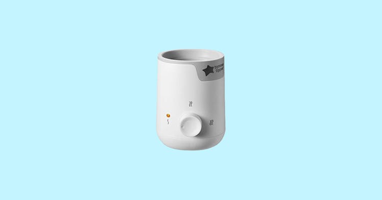 a white baby bottle warmer, set against a light-blue background; one of the best baby bottle warmers...