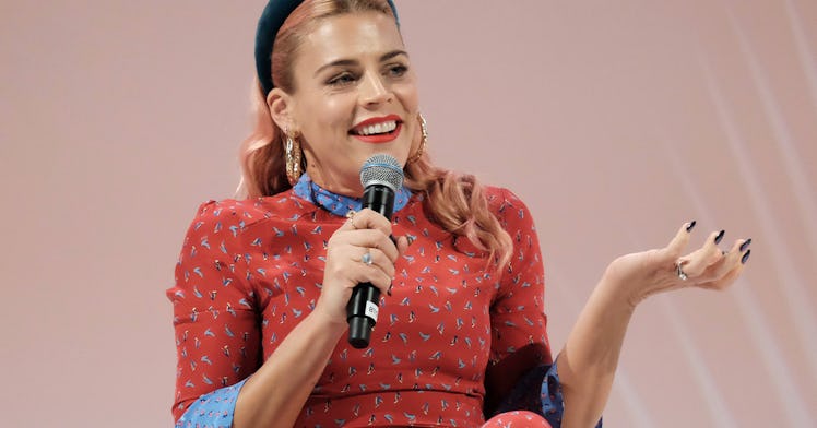 Busy Phillips speaks into a microphone