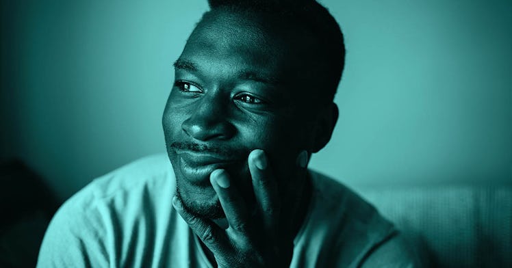 A man smiling and looking into the distance after beating his Covid stress