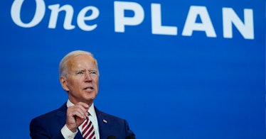 Joe Biden speaks in front of a blue background