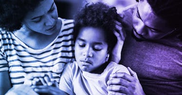 a couple going through divorce old on to a sad looking child