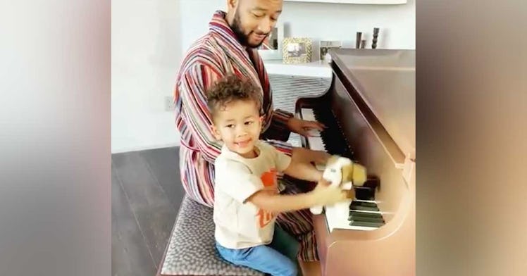 John Legend and Miles play the piano