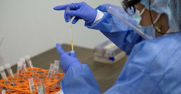 vaccines are administered by someone wearing PPE
