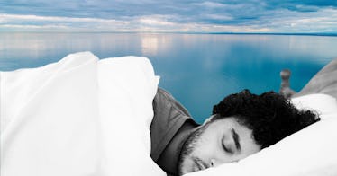 a guy covered with sheets falls asleep on a pillow