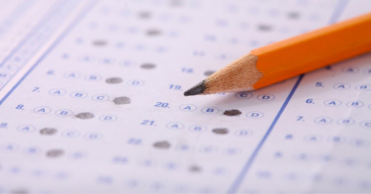 A standardized test bubble sheet with a pencil