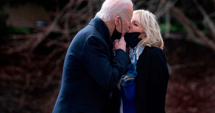 Joe and Jill Biden give each other a kiss outside