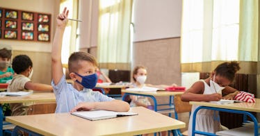 Students are masked in a distanced classroom