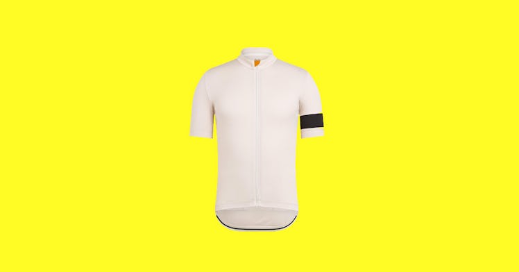 A white cycling jersey with a black stripe on the arm, one of our picks for men's cycling clothing, ...