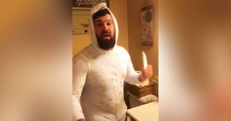 A dad in a unicorn onezie imitates his daughter