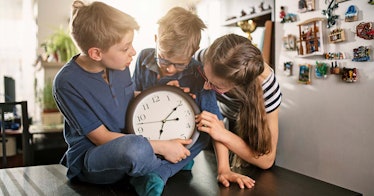 Kids look at a clock