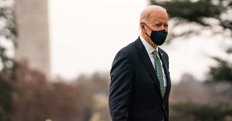 Biden walks with a mask on outside