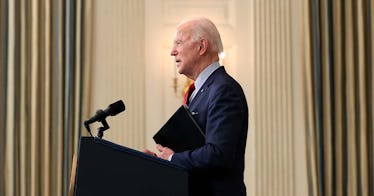 President Joe Biden speaks at a podium