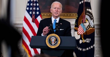 Joe Biden speaks with a flag