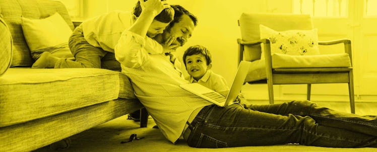 A father playing together with his kids while working from home during the pandemic