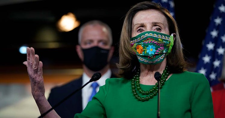 Nancy Pelosi speaks with a mask on