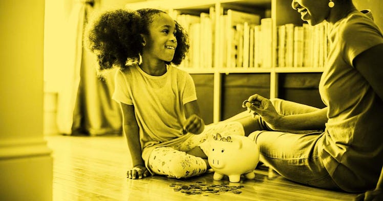 A kid sitting in front of a piggy bank in a yellow filter