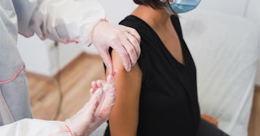 A pregnant person gets a vaccine