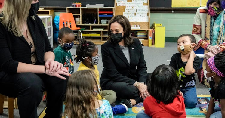 VP Harris sits with students in a classroom