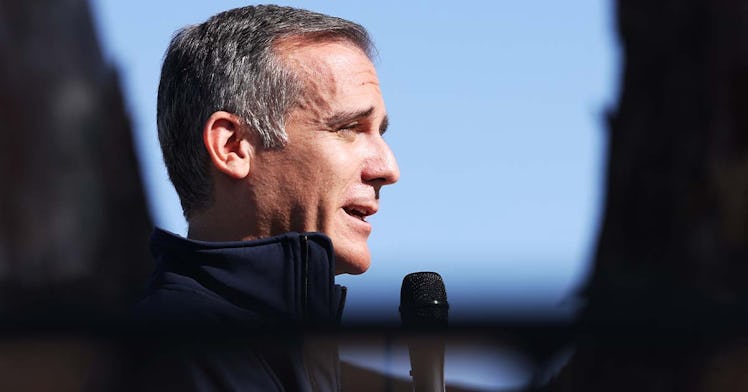 Mayor Eric Garcetti speaks into a microphone