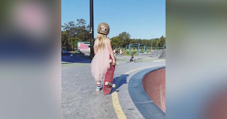 6-year-old Paige Tobin wears a party dress to do a 12 foot bowl